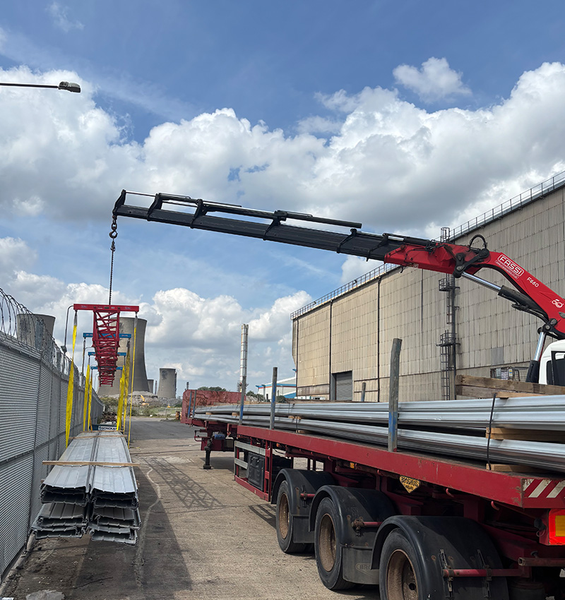 construction workers observing crane at building site with 5 key insights on progress
