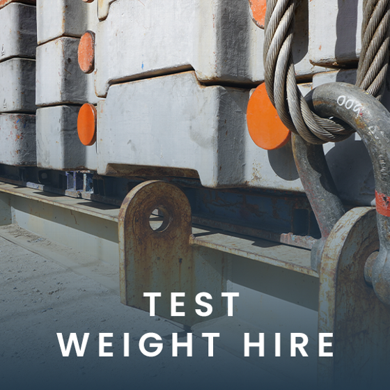 Heavy truck lifting a cargo container with a crane at a loading dock in cloudy weather showcasing transport logistics and loading efficiency.